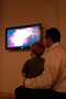 Young and younger alike are captivated by the exhibit, including physics professor David S. Richards and son