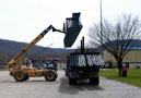 As more 80-foot steel joists wait in the background, a lift truck shuttles a heavy load to the ATC job site