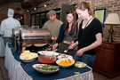 Students serving themselves at the 'potato bar' are, from left, Alex R. Figueiredo, a welding and fabrication engineering technology major from Colmar; Brittany N. Bixler, of Rexmont, enrolled in building science and sustainable design: building construction technology concentration; and Lauren E. Zinn, a dental hygiene: health policy and administration concentration major from Dillsburg