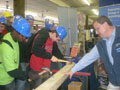 Steven K. McCoy supervises nail-driving contest