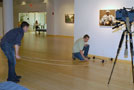 The Channel Nine team moves dolly tracks onto the gallery floor to facilitate fluid camera movement