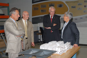 The Plastics Manufacturing Center's new Thermoforming Center of Excellence was the first stop of a brief campus tour Thursday for the Pennsylvania College of Technology Board of Directors' two newest members%3A John J. Romano, left, and Steven P. Johnson, second from left. College President Davie Jane Gilmour led the tour, joined here by board chairman Robert E. Dunham.