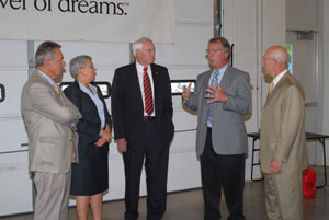 Senior Vice President William J. Martin, second from right, discusses the changing face of automotive diagnostics during a visit to the Parkes Automotive Technology Center's new Honda laboratory.