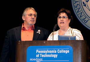 Edward C. and Cheryl A. Garis accept a diploma for their daughter Tracy A. during a Pennsylvania College of Technology commencement ceremony on May 13. Tracy Garis died in a vehicle accident last year. Penn College students raised more than %2435,000 for a scholarship memorializing their classmate from Hellertown.