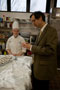 Fred Becker, dean of hospitality, samples a Chocolate Irish Cream Mousse Cup created by Alexandra L. Eckholm, Mill Hall