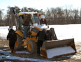 Students clear snow prior to a safety inspection