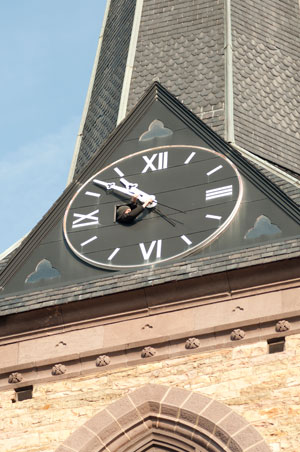 Patrick Tomaszewski, of Swoyersville, reattaches the Trinity Episcopal Church clock%E2%80%99s hands onto a new shaft.
