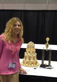 Kelly E. Rockwell, with her butterfly-themed cake - and the trophy earned at competition in Atlantic City.
