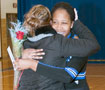 Ursula A. Peterson, a senior member of the Wildcat Dance Team, is congratulated by coach Milissa Augustine