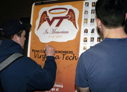 Students sign a support poster to be sent to Virginia Tech.