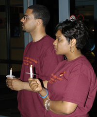 Israel Laguer and Shadra D. Smith listen to Penn College Police Chief Chris Miller.