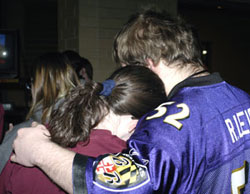Students console each other during a video tribute to Virginia Tech victims.