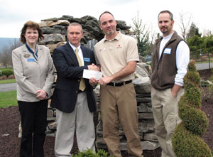 Pennsylvania College of Technology horticulture instructor Carl J. Bower Jr. (second from left) accepts a %24500 donation from Pat McVicker, a regional recruiter for ValleyCrest Landscape Maintenance, joined by Mary A. Sullivan, dean of the college%E2%80%99s School of Natural Resources Management, and Fred Barberra, a designer%2Festimator with ValleyCrest%E2%80%99s Norristown office.