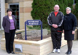 Pennsylvania College of Technology President Davie Jane Gilmour, at right, dedicates the Veterans%E2%80%99 Portico, assisted by student veterans Stephanie A. Dimon, a legal assistant-paralegal studies major from Avis who served in the Air Force from 1996-2004, and Chester M. Beaver, of Williamsport, a general studies major and an Army retiree with 25 years%E2%80%99 service.