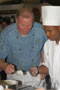 Schimoler demonstrates his plate design to Darnell Bungy