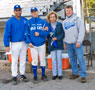 Baseball senior joins coach and parents for group photo