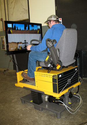 Trevor J. Horton, a Pennsylvania College of Technology student from Curwensville, operates a simulator on loan from Volvo and the Oryx Co.