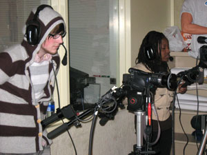 Mass media communications students Justin L. Wisser and Shanee B. Robinson operate cameras.
