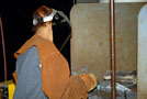 A girl tries her hand at cutting in the welding lab
