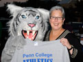 The Wildcat presents a gift to college President Davie Jane Gilmour