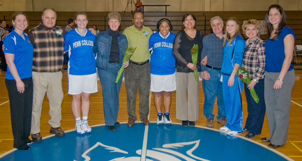 Also acknowledged on Senior Night were graduating members of the women's basketball team. Joining parents at midcourt were, from left, assistant coach Kim Antanitis, Erica Logan, Meagan Morris, Erin Mahoney and head coach Alison Tagliaferri.
