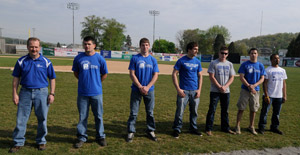 Coach Schuyler Frey's conference champion wrestlers are acknowledged outside the Field House