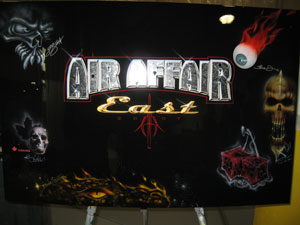 Artists leave their respective mark on the Air Affair East board.
