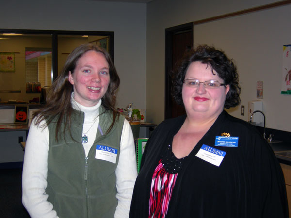 Early childhood education alumni Barbara A. Peck, '09, (left) now working at the Pitter Patter Day School in Muncy, and Jennifer N. Bay, '97, a group leader at the college's Children's Learning Center, return to campus as Open House volunteers.