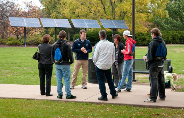 Helpful Student Ambassador Corey A. Shank answers questions near the college's energy-saving photovoltaic panels
