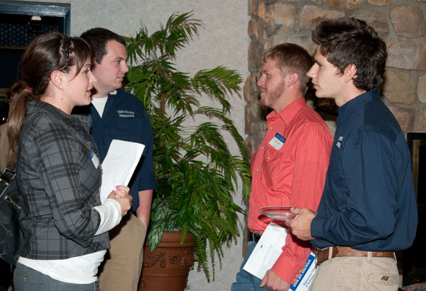 Current Student Ambassadors Adam Yoder and and Anthony Grubbs (in blue shirts) chat with former Ambassadors Justine Wareham ('09) and John Lipko (08).