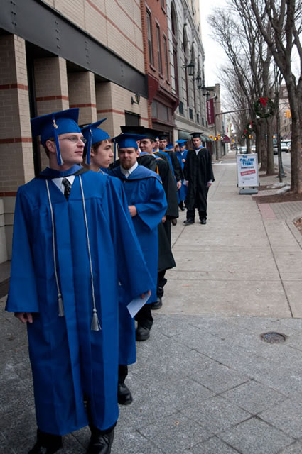 Something old and something new: New graduates process past the downtowns historic facades.