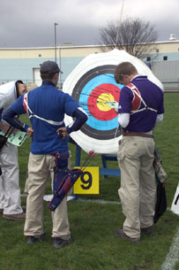 Tournament participants assess accuracy during Saturday's qualifying round