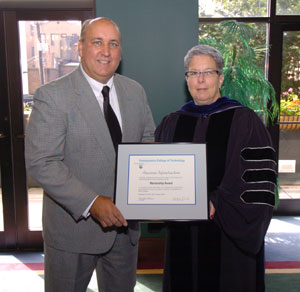 Gordon Bryan, vice president of career development, American Infrastructure%3B and Davie Jane Gilmour, president, Pennsylvania College of Technology.
