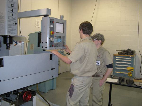 Teammates work together in the automated manufacturing competition, held in College Avenue Labs.