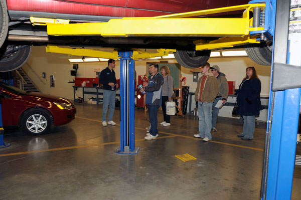 Christopher J. Holley, assistant professor of automotive technology, shows off one of the college's impressive labs.