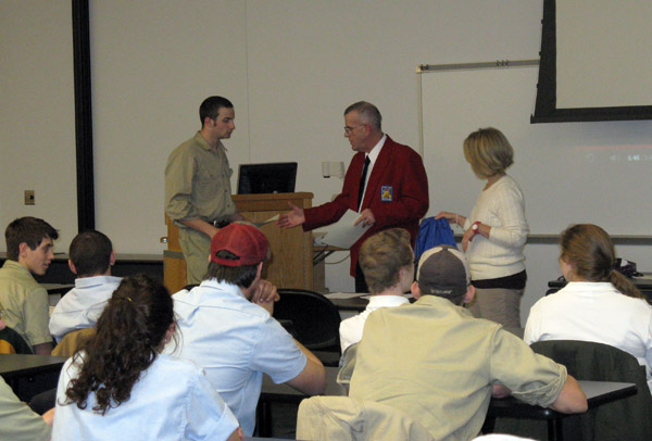 Edward L. Roadarmel, assistant professor of drafting and computer aided design, aided by Stacey C. Hampton, coordinator of matriculation and retention for the School of Industrial and Engineering Technologies, congratulates a SkillsUSA medalist.