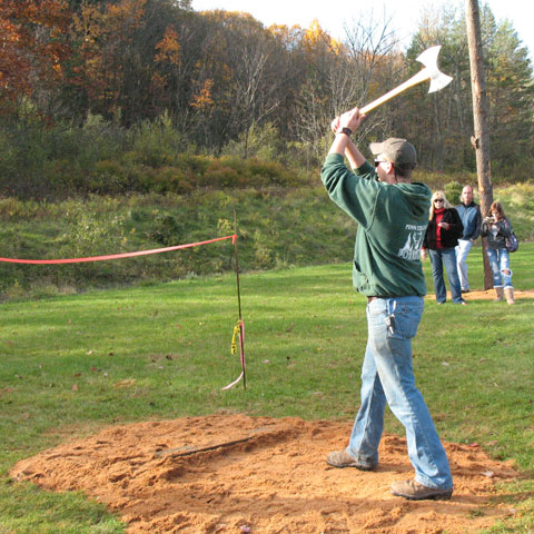 A participant in the Woodsman's Meet at the Earth Science Center near Allenwood prepares for the ax-throwing event.