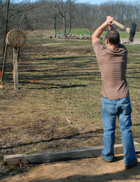 Forest technology student Michael C. Frantz practices the ax throw for an April 17 woodsmen's meet.