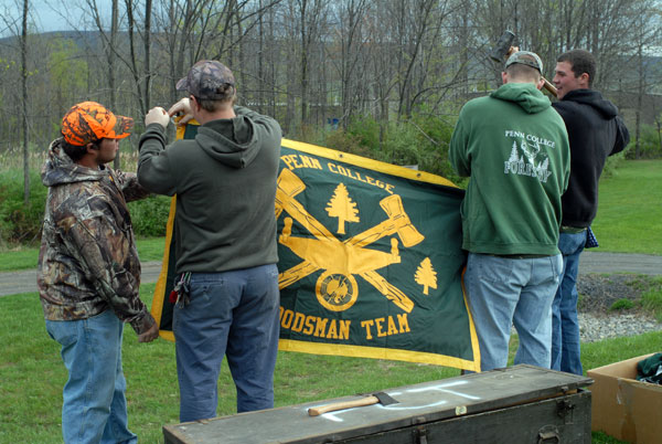 Penn College competitors stake out their turf with the Forestry Club banner.