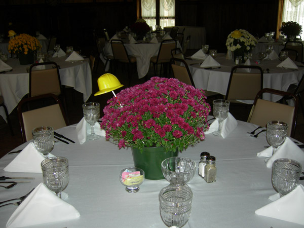 Miniature hard hats add a fitting touch to centerpieces at the construction management reunion.