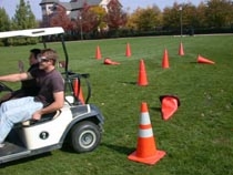 Students simulate intoxicated driving during a prior year's 'Alcohol Awareness Week' observance