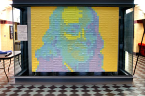 A portrait of Benjamin Franklin, comprised of more than 1,700 Post-it notes, adorns the Bush Campus Center elevator in observance of International Printing Week.
