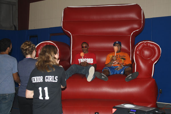 Students enjoy cotton candy in a Welcome Weekend favorite: "the big chair."