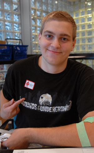 A donor proudly displays his 'I DONATED BLOOD TODAY' sticker at Wednesday's Bloodmobile in Penn's Inn.