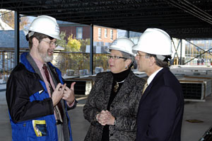 Richard J. Calvert, assistant professor of electronics (left), explains some of the new building's laboratory features to college President Davie Jane Gilmour and state Rep. Brett O. Feese.