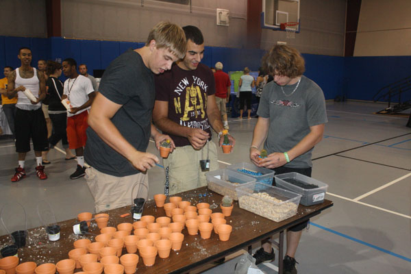Students pot cacti during a CampusFest activity.