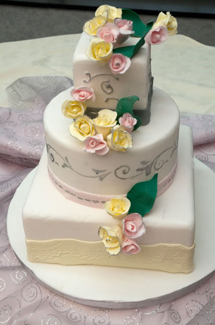 Delicate roses join yellow lace and silver stenciling.