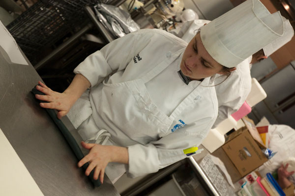 Abigail Schuler rolls out black fondant in preparation for the contest.