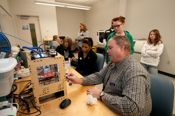 Eric K. Albert, associate professor of machine tool technology and automated manufacturing, entertains guests with a session on three-dimensional printing through Rapid Prototyping.
