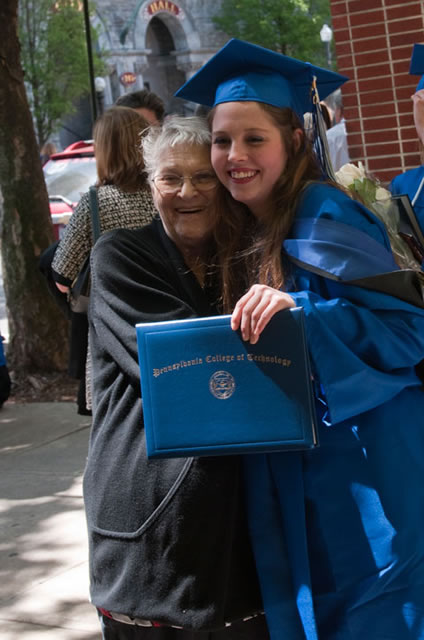 Early childhood education graduate Trena M. Paxton celebrates with her grandmother.
